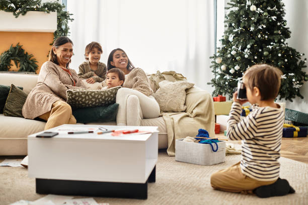A cheerful family gathers in their stylish living room, celebrating Christmas with warmth and joy.